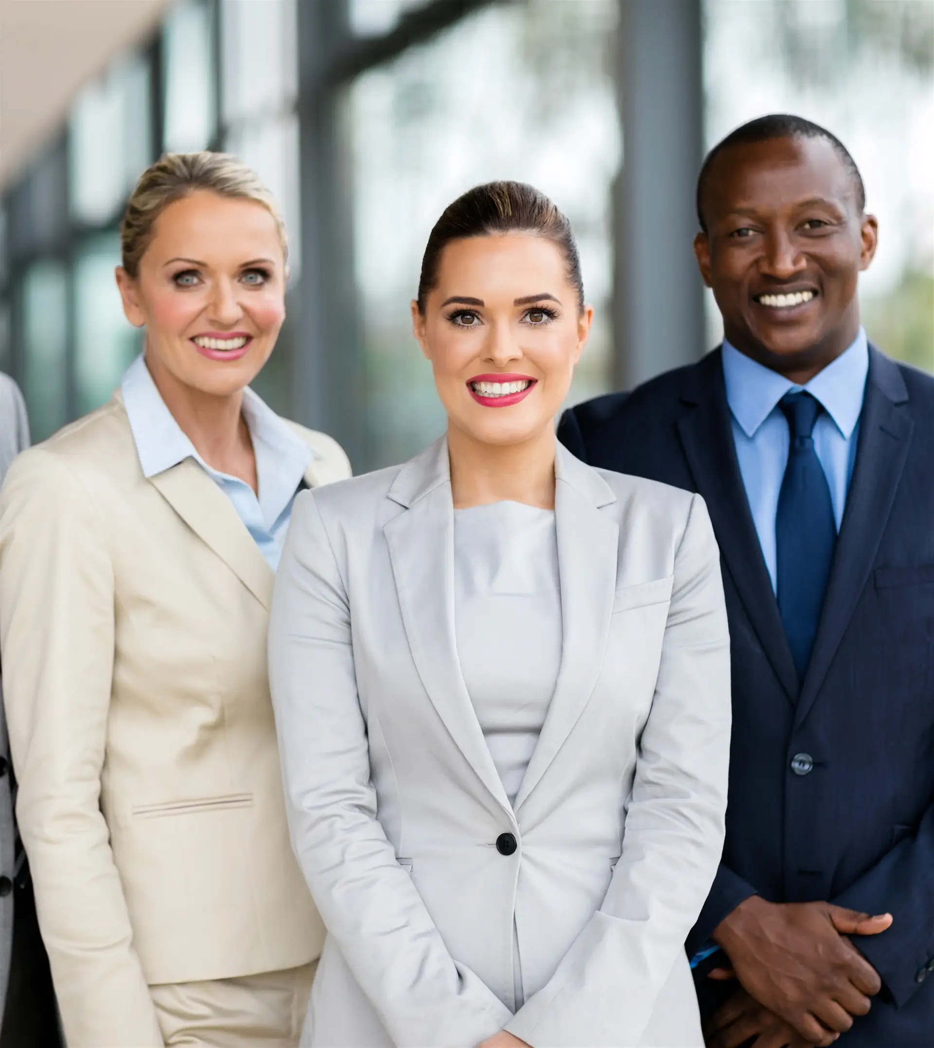 Modern brick office building with large windows and planters along the walkway